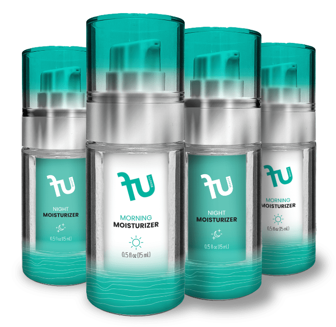 A photo shows four clear skincare bottles with silver pumps and teal caps, arranged in two rows. Each has a white label featuring a teal "fu BEAUTY" logo. Two bottles are marked "NIGHT MOISTURIZER" with a moon and stars icon, while the other two are labeled "MORNING MOISTURIZER" with a sun icon. Each bottle contains "0.5 fl oz (15 mL)" and has a teal band with white wavy lines at the bottom.