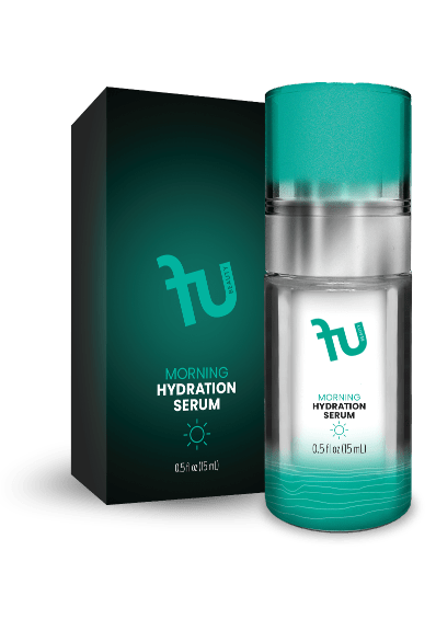 A photo shows a "fu BEAUTY Night Moisturizer" bottle and box on a black background. The clear bottle has a silver pump, teal cap, and teal label with the "fu BEAUTY" logo, "NIGHT MOISTURIZER," a moon and stars icon, and "0.5 fl oz (15 mL)." The bottle contains teal liquid with wavy lines at the bottom of the label. The dark teal box also displays the "fu BEAUTY" logo, "NIGHT MOISTURIZER," a moon and stars icon, and "0.5 fl oz (15 mL)."